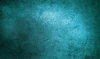 Vibrant turquoise surface texture with subtle grainy patterns, perfect for artistic and design projects. photo