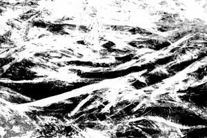 High-contrast abstract texture with chaotic black and white streaks and rough grunge patterns, ideal for backgrounds. photo