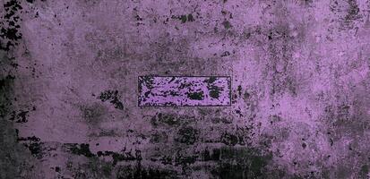 A grunge textured wall with striking purple and black patterns, perfect for backgrounds, designs, and creative projects. photo