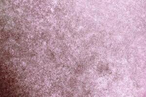 Soft pink textured gradient background with a slightly grunge and weathered effect, ideal for creative projects. photo