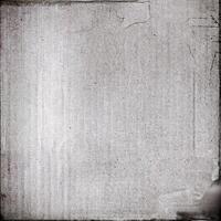 A grungy, vintage textured paper background with visible wear and tear, cracks, and subtle creases. photo