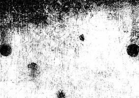 High-contrast grunge texture with black scratches, marks, and distressed patterns on a white background. photo