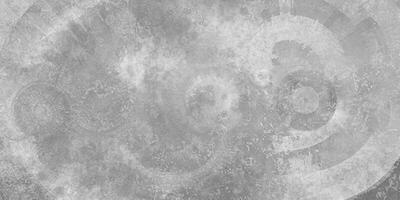 A circular grunge abstract texture in grayscale, featuring concentric lines and cloudy patterns for design use. photo