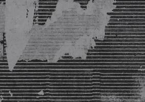 Distressed black and gray grunge texture with horizontal stripes and rough details, perfect for abstract backgrounds and overlays. photo