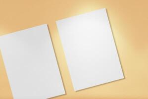 White A4 Papers on Light Gold Background. photo