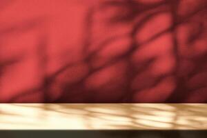 Light Brown Table with Light Beam and Shadow Red Concrete Wall. photo