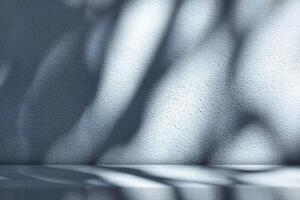Stucco Table with Nature Shadow on Concrete Wall Texture Background in Cyan Blue Tone photo