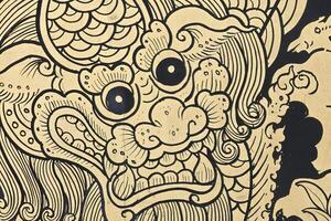 Close up Vintage Golden dragon, Ancient Thai Pattern Art on window at Wat Hong Rattanaram photo