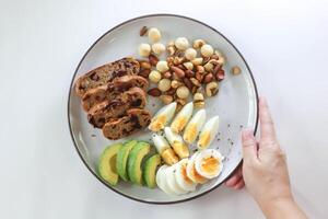walnut cranberry sourdough bread or cranberry sourdough with boiled egg , avocado and nuts photo