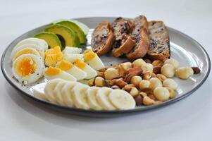 walnut cranberry sourdough bread or cranberry sourdough with boiled egg , avocado , banana and nuts photo
