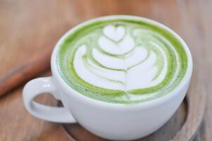 green tea or matcha latte , matcha green tea latte , milk green tea photo