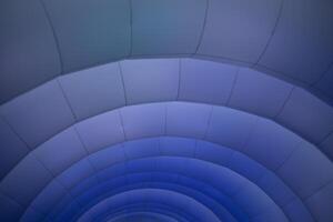 Inflatable structure in detail. Texture of arc lines. Purple glow on the structure. photo
