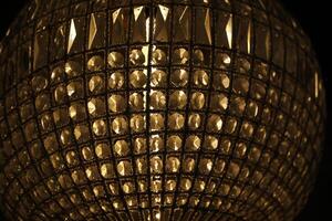 Crystal ball. Unusual lamp in the interior. Round lamp. photo