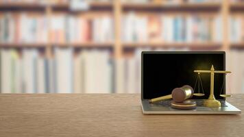 The Wood hammer and Libra on labtop for law concept 3d rendering. photo