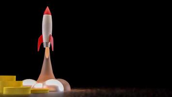 The Rocket and coins for Business or start up concept 3d rendering. photo