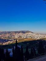 Ain Bouanane offers a stunning panoramic view from above the hills, overlooking the vibrant city of Tetouan, Morocco, a view that is truly unbelievable from this high vantage point photo