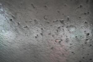 Soapy car windshield view from inside a car during an automatic wash cycle. photo
