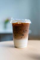 Cup of ice cafe latte with two layer, espresso and fresh milk photo