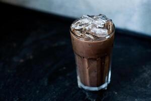 Refreshing iced coffee Mocha filled with ice cubes. photo