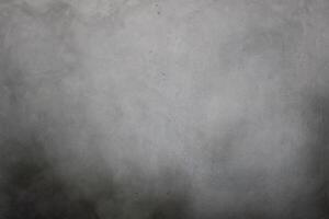 Grey textured concrete wall background photo
