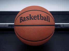 An orange basketball featuring the word 'Basketball' prominently displayed. photo