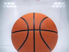 Close-up of a textured orange basketball on a bright background. photo