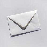 A sleek white envelope lies on a minimalist background, perfect for letters or invitations. photo