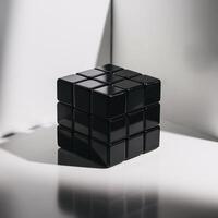 A sleek black Rubik's Cube resting on a minimalist surface, casting soft shadows in natural light. photo
