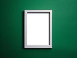 Empty white frame on a vibrant green background, perfect for showcasing artwork or photos. photo