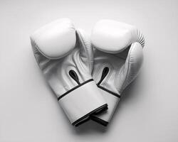 A pair of pristine white boxing gloves on a neutral background, symbolizing training and competition. photo