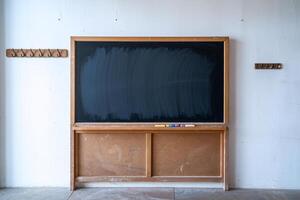 Empty blackboard in a light classroom setting, inviting creativity and learning. photo