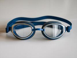 Blue swimming goggles with a sleek design, ideal for competitive swimmers or recreational use. photo
