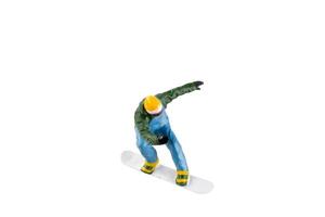 Miniature figurine depicting a snowboarder in mid-motion isolate on white background with clipping path photo