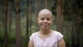 Bald Woman with Down Syndrome Smiles Joyfully in Lush Forest Setting. Portrait Photography Concept. photo