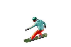 Miniature figurine depicting a snowboarder in mid-motion isolate on white background with clipping path photo