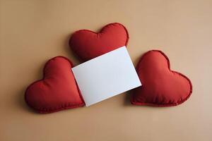 A blank white card mockup is presented on three heart shape red pillows representing Valentines Day photo