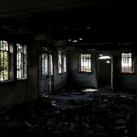 Abandoned Building with Decay and Shadow Interplay photo