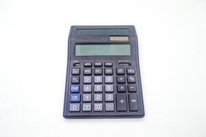 A black electronic calculator with a large display and multiple function buttons on a white background. Ideal for office, school, or home use photo