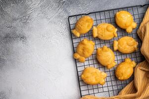 Korean pancake Bungeoppang, Fish shaped Waffle with sweet red bean filling. white background. top view photo