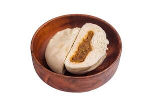 Chinese Steamed bun with meat on plate isolated on white background. top view photo