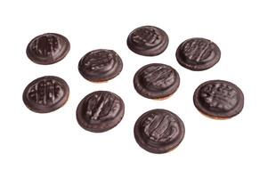 Jaffa cakes, Cookies covered with chocolate and filled with jam isolated on white background photo