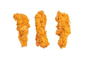 Crispy fried chicken strips from breast fillet isolated on white background photo