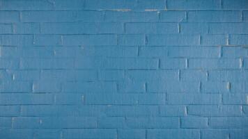A bright and colorful blue brick wall surface, ideal for backdrops, textures, or design projects. Featuring a subtle pattern. Modern abstract blue background for advertising, backdrop, display, decor photo