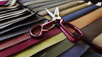 Scissors and Colorful Fabric Palette Examples in The Tailor Shop video