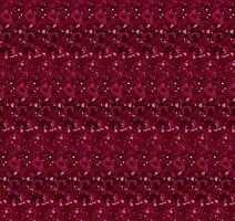 Seamless pattern with complex abstract shapes in vibrant red and pink tones. Can be used for fabric prints, including clothing, bedding, and curtains, wallpaper or interior decor applications. vector