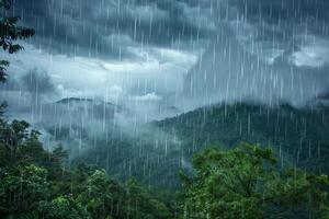 Rain falling over a forest and mountains photo