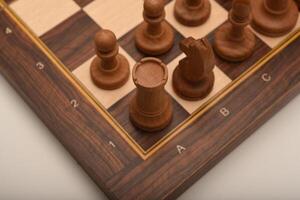 Black and white chess. Wooden chess on a board. A chess game. photo