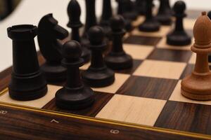 Black and white chess. Wooden chess on a board. A chess game. photo