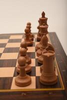 Black and white chess. Wooden chess on a board. A chess game. photo