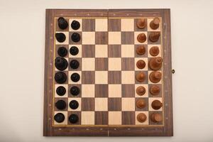 Black and white chess. Wooden chess on a board. A chess game. photo